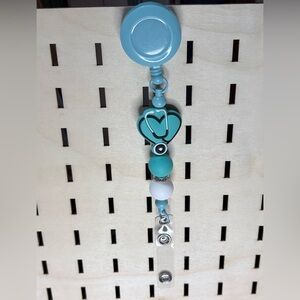 Handcrafted blue nurse theme badge reel